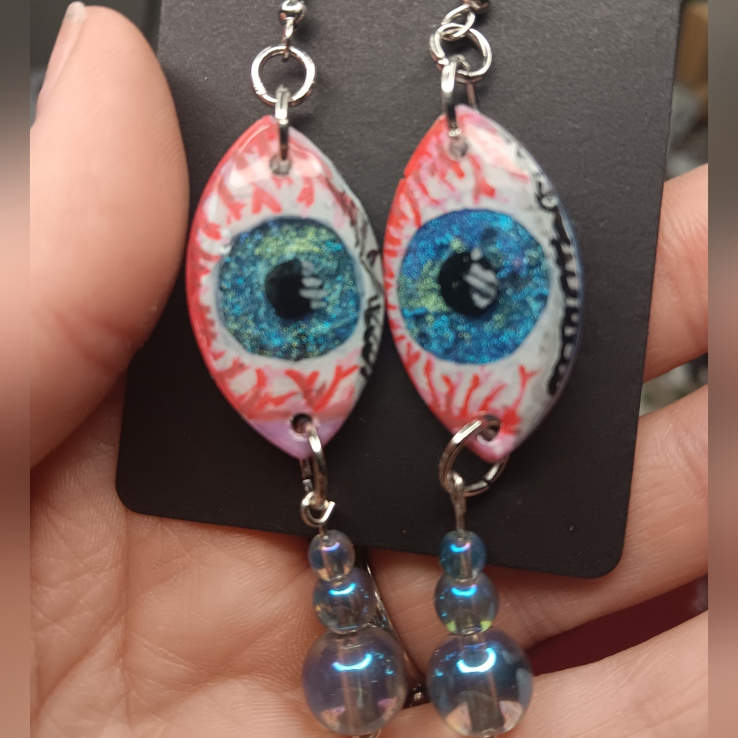 Cryinh Eye Earrings With Blue And Pink Accents